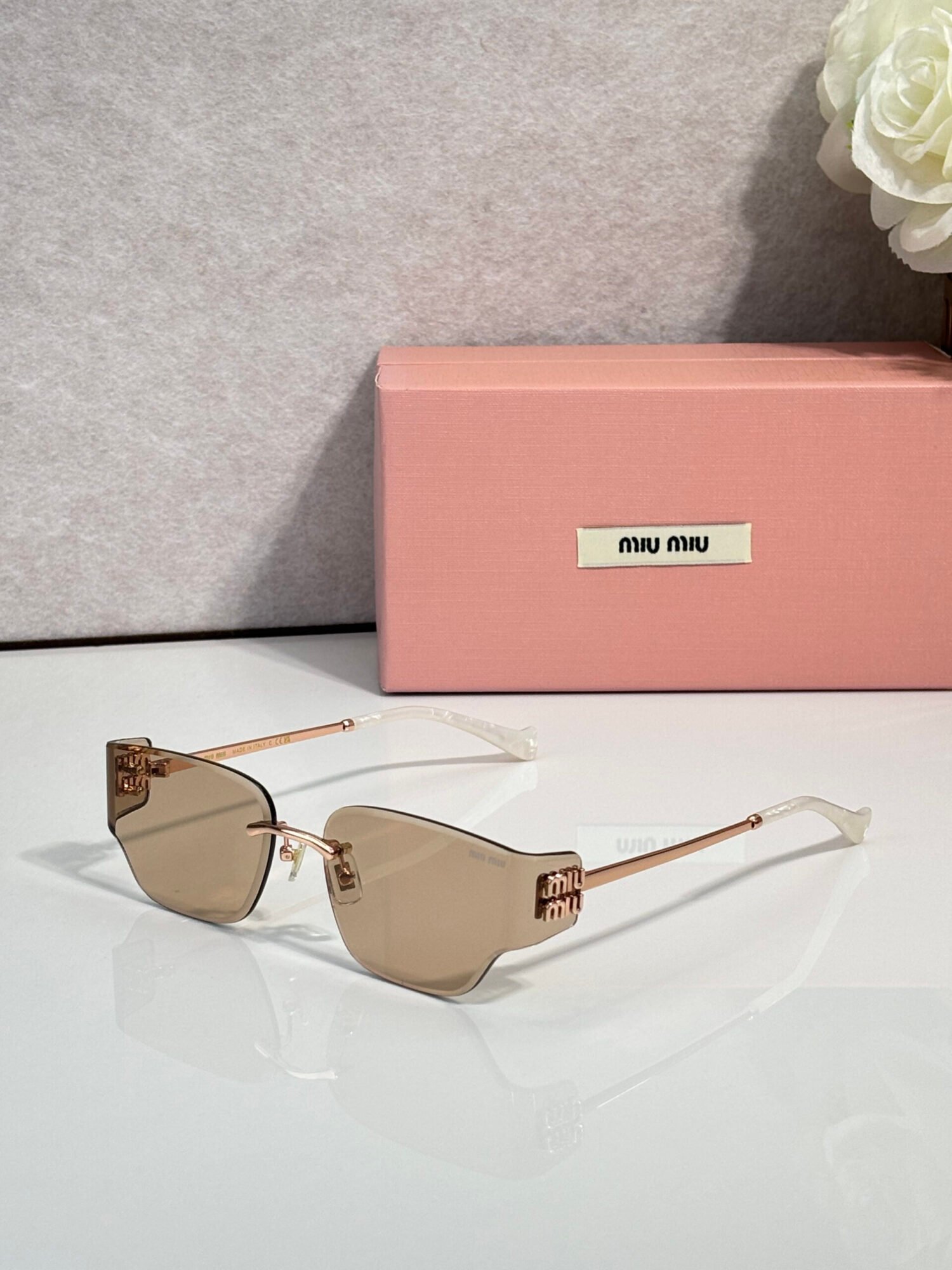 b19e820a MIU MIU MU 176AV Sunglasses - Image 1